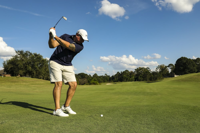 A golfer swinging the club